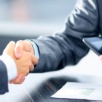 Business people shaking hands in office